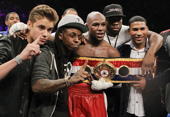 Justin-Bieber-Lil-Wayne-Floyd-Mayweather-50-cent Lil Wayne & Maidana's Entourage Scuffle It Out After Floyd Takes The Victory (Video)  
