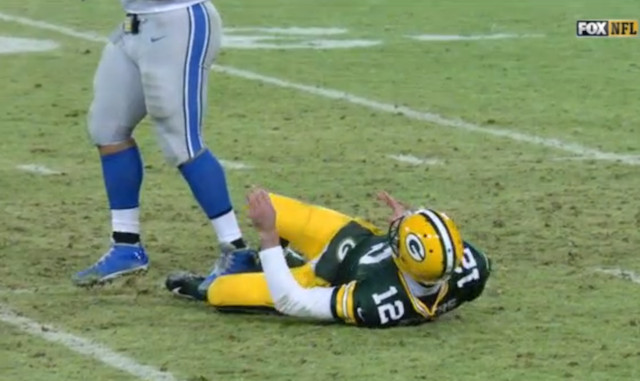 Rodgers-Suh-ankle-lions-packers-1 Detroit Lions DT Ndamukong Suh Has Been Suspended For The NFL Wild Card Weekend  
